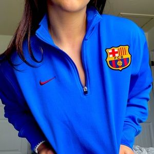 Blue Nike FCB(Futbol Club Barcelona) crew neck quarter zip up.